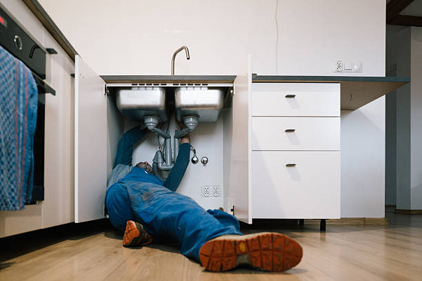 Professional Emergency Plumber technician working in Isanti, MN
